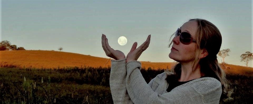 Full moon, two hands